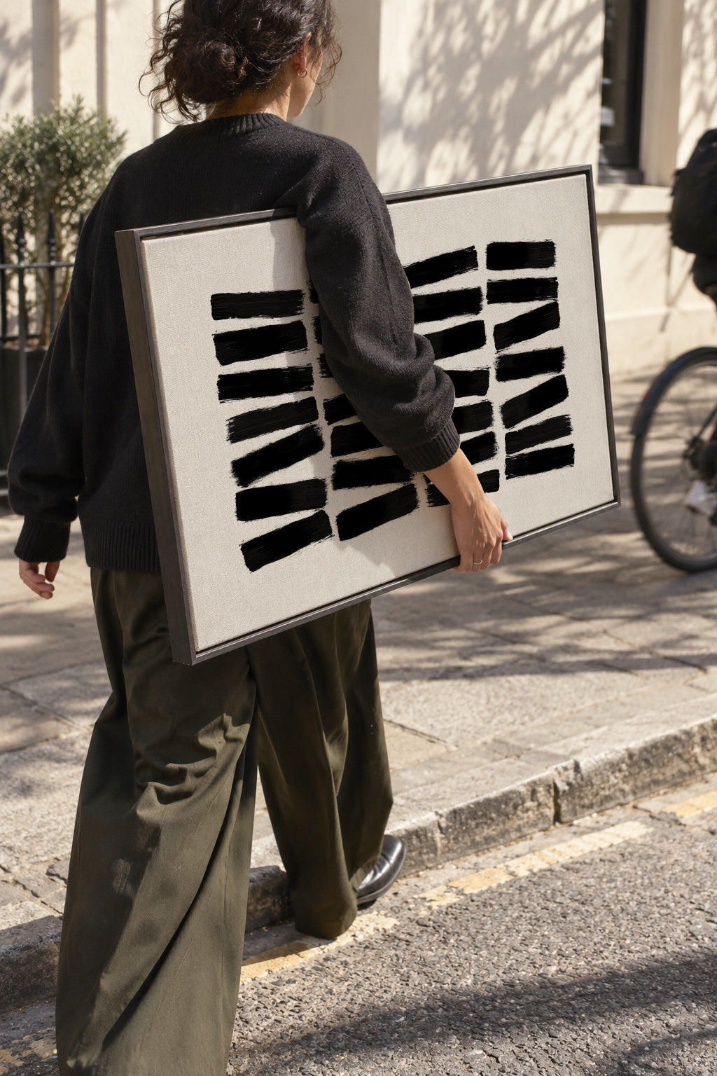 Black Brush Strokes - Framed canvas in an interior