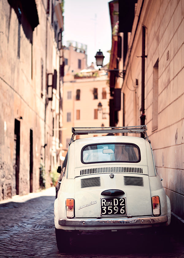 Travel poster featuring a classic car on a Roman street