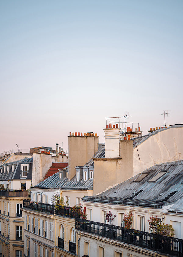 Travel poster of urban rooftops at sunrise