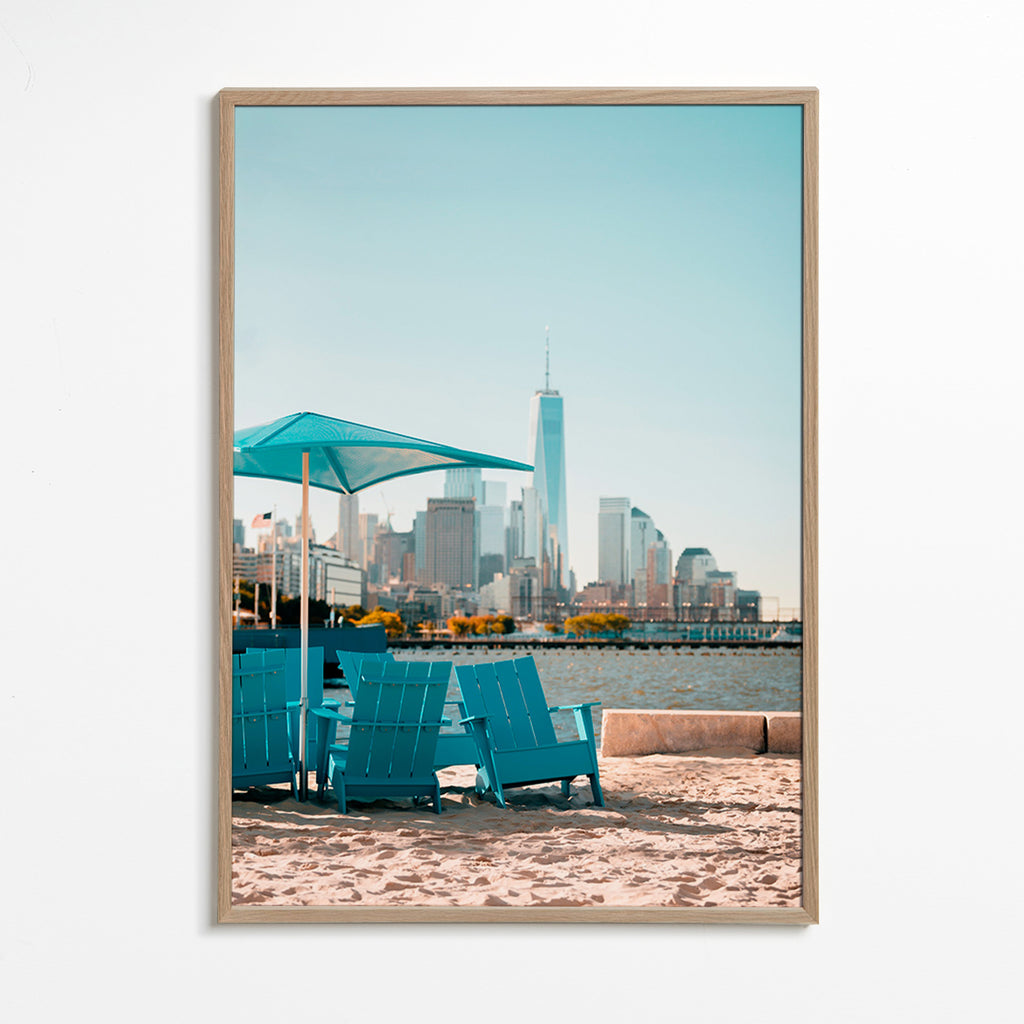 Travel poster with turquoise beach chairs and city skyline – Oak Frame