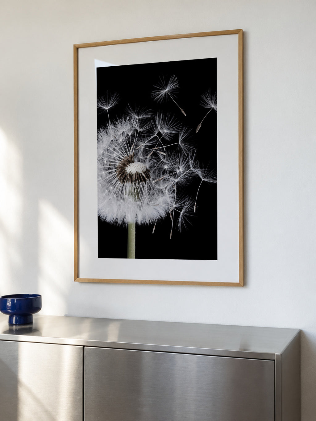 Dandelion Blowing - Framed poster in an interior