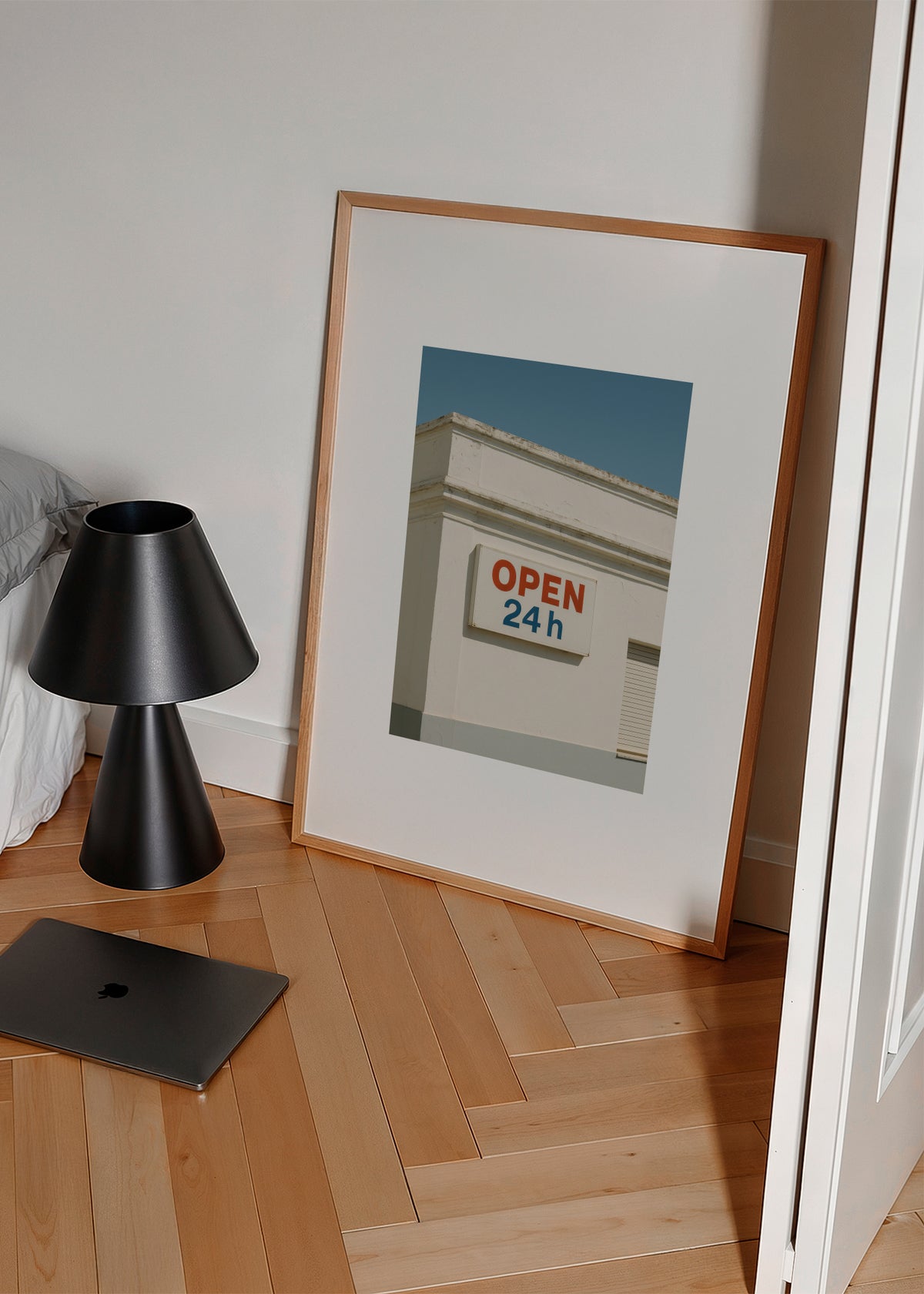 Open 24h - Framed poster in an interior