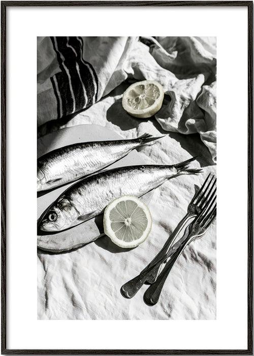 Kitchen art: monochrome sardines and lemon still life