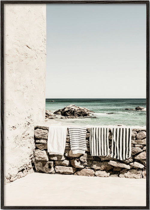 Coastal landscape photograph with hanging towels